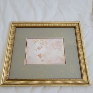 Gold and sage green picture frame with art print of female sketch inside